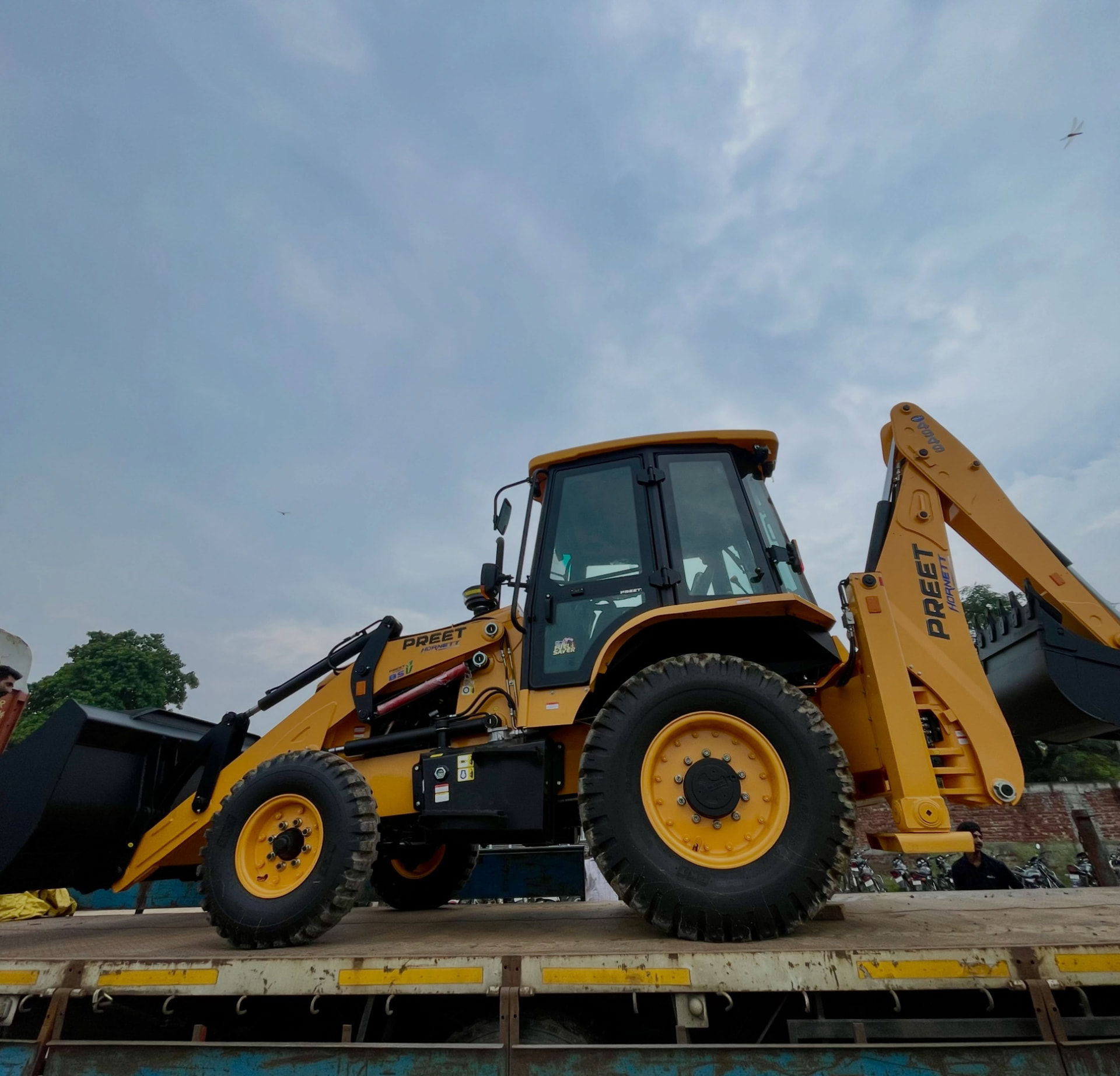 Preet backhoe loader side profile studio photograph